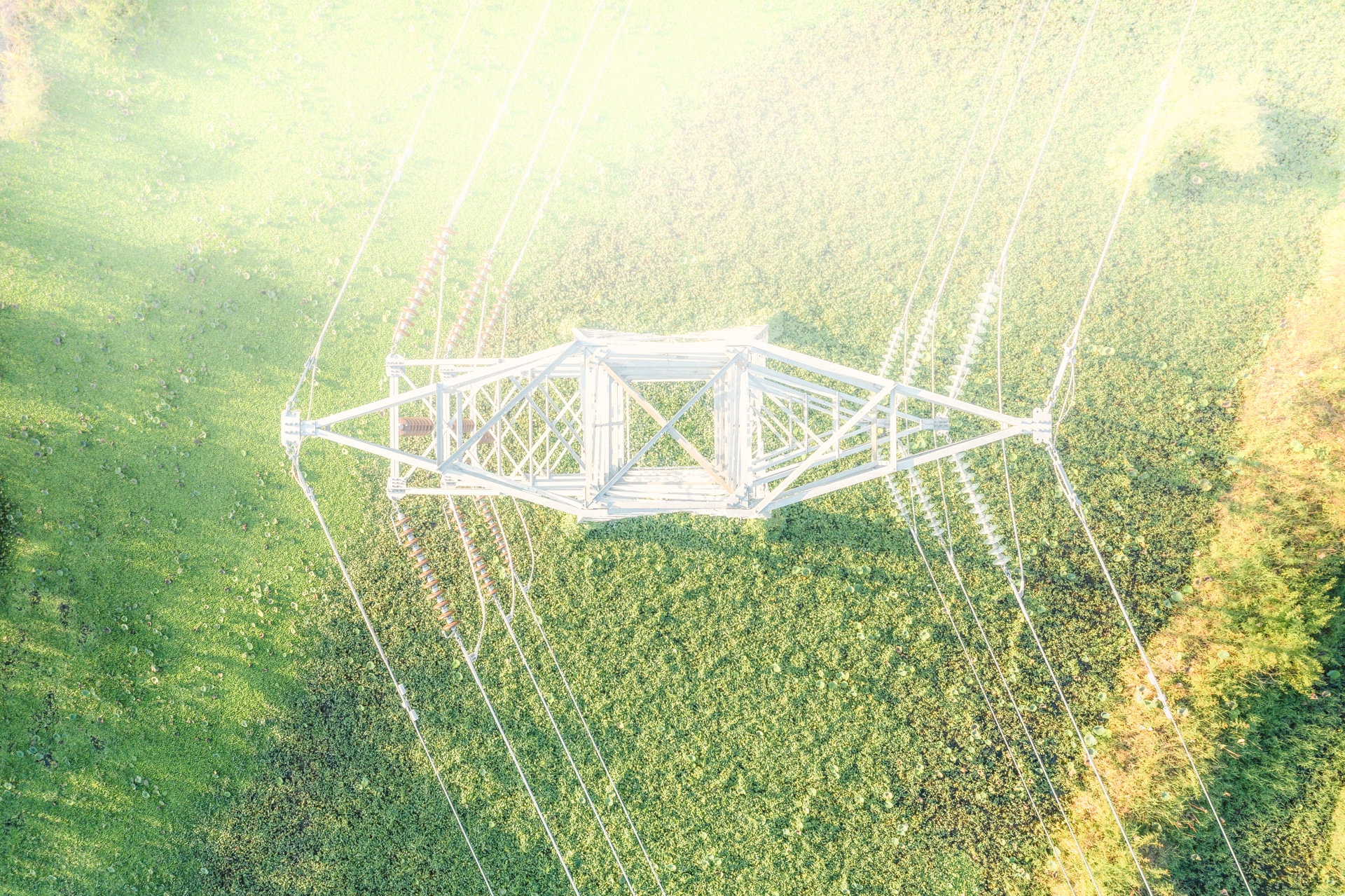 Transmission tower or electricity pylon in aerial view